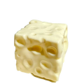 Cream-colored cube-shaped cheese squishy toy with textured surface and holes for slow rising sensory stress relief