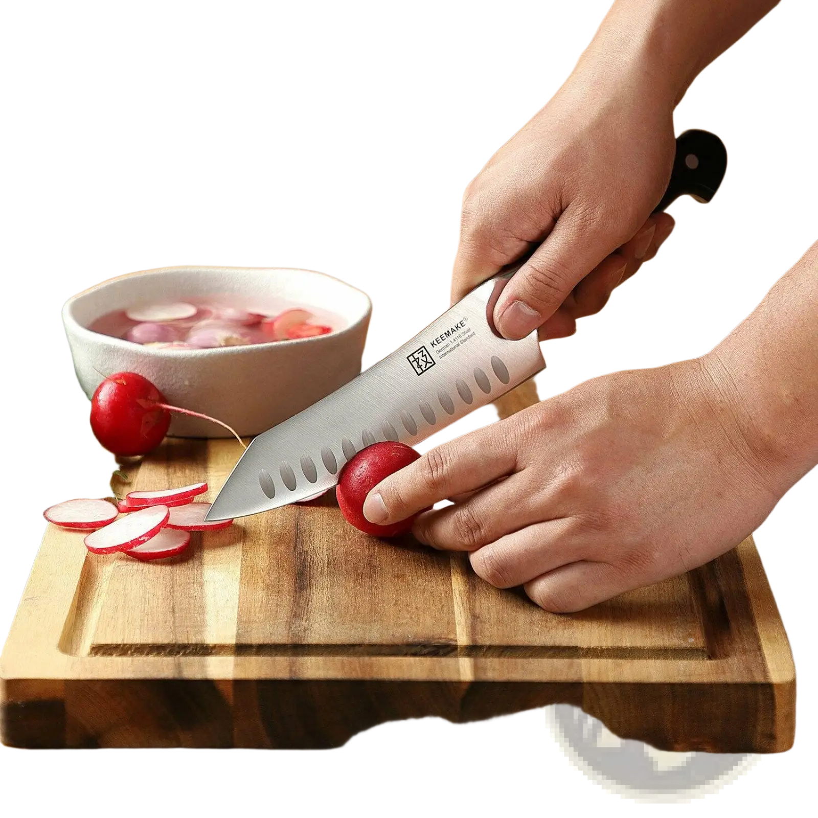 A sleek kemake chef knife with a silver stainless steel blade and black handle featuring oval cutouts