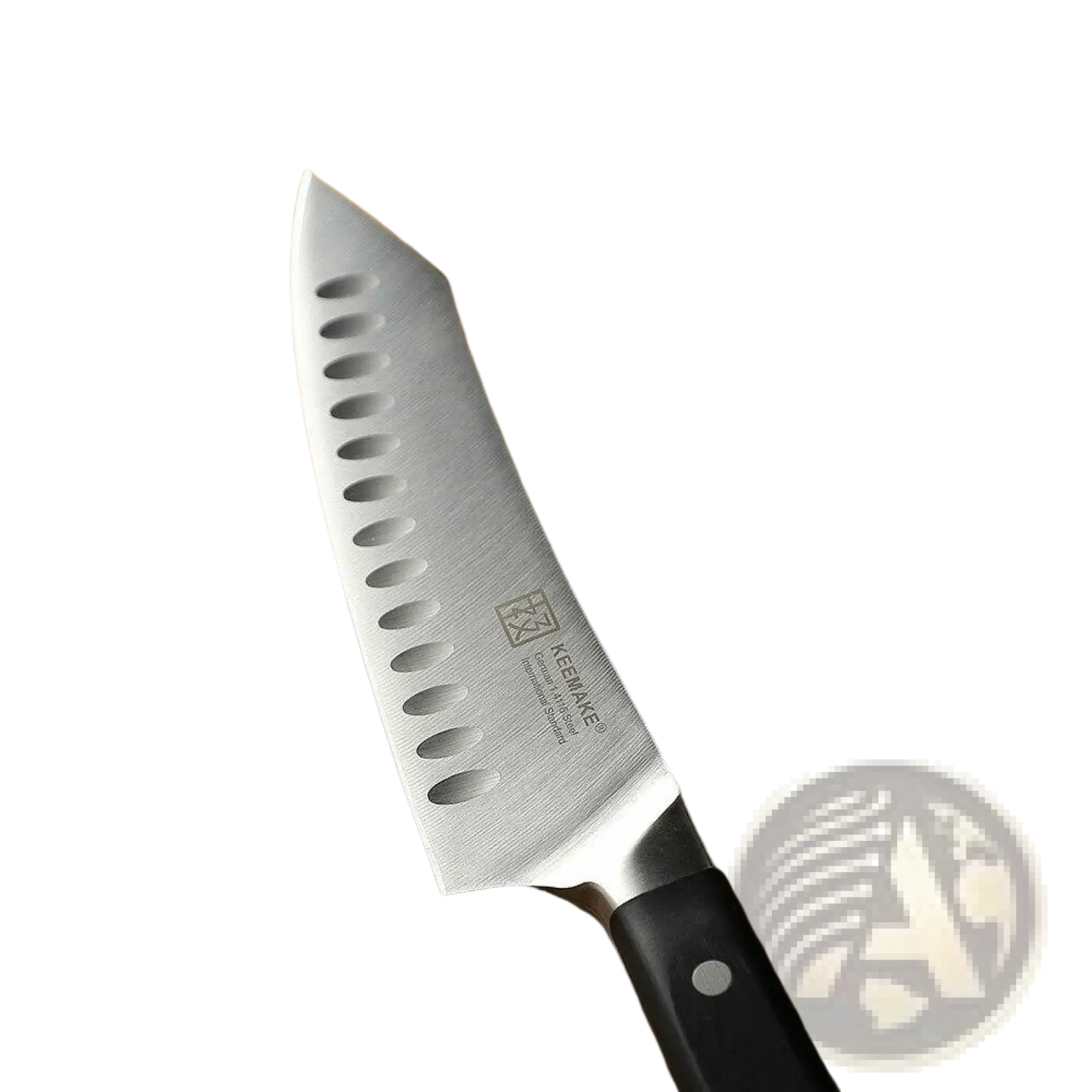A sleek stainless steel chef knife with black handle and oval blade holes included in a chef knife set with kitchen shears
