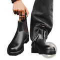 Black leather chelsea boots unisex vintage martin boots with dark brown lining and white stitching along seams