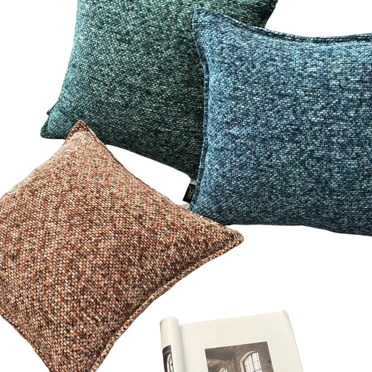 Three chenille throw pillow covers in earthy brown teal green and deep blue with textured woven fabric finish