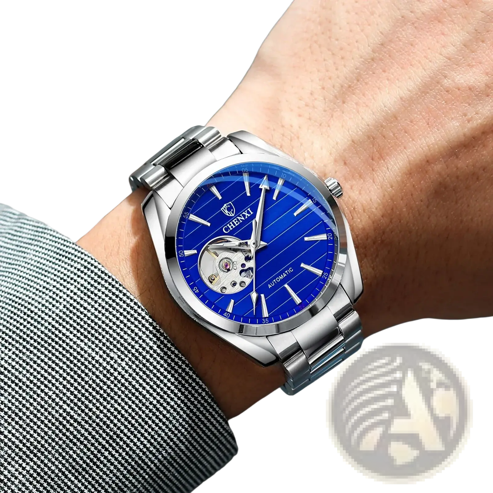 A sleek silver-toned chenxi automatic mechanical men watch with a vibrant blue dial and visible movement