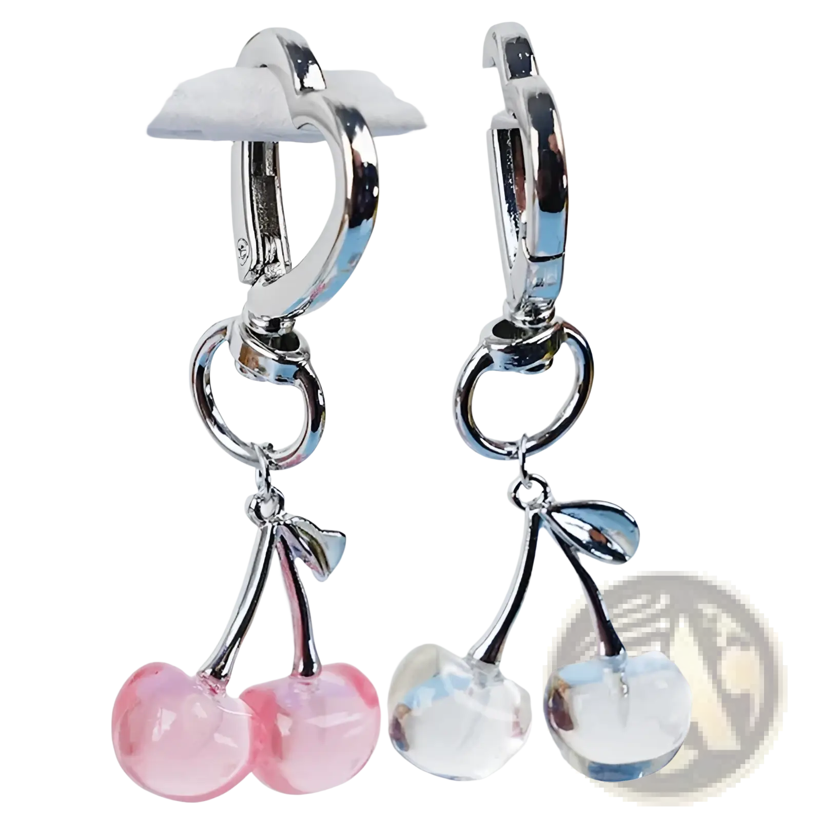 A pair of silver-toned hoop earrings with dangling pink and clear faceted cherry charms from cherry bag charm heart keychain