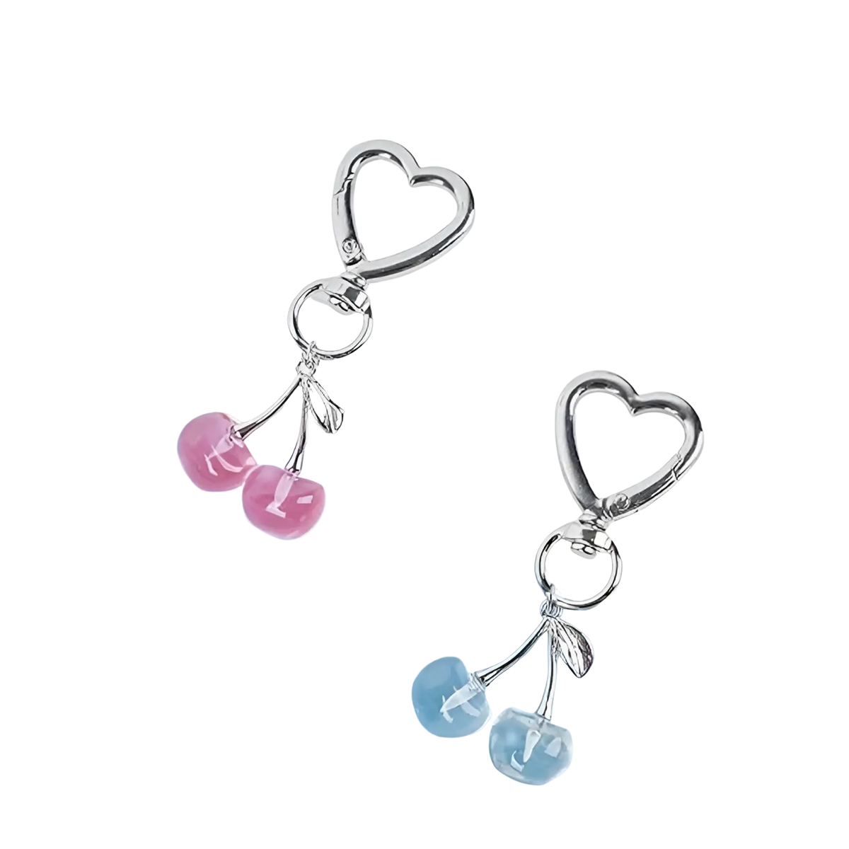 Silver heart-shaped keychain with dangling pink and blue cherry charms designed as a stylish bag charm accessory
