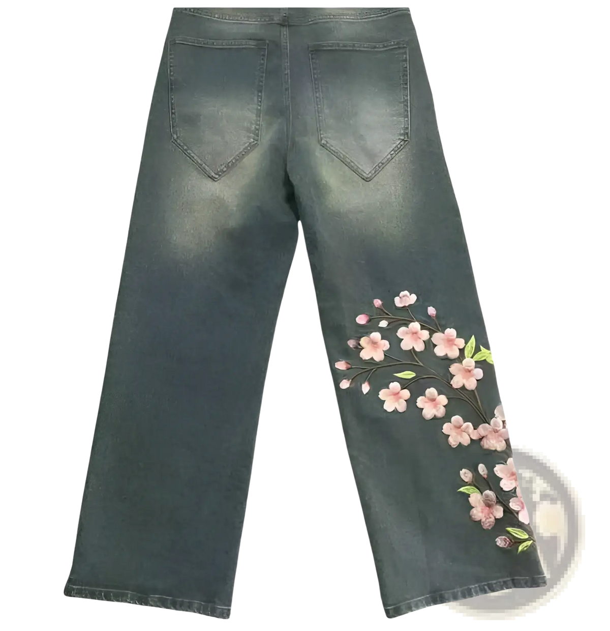 Dark-wash denim jeans with delicate pink cherry blossom embroidery along the outer seam of one leg