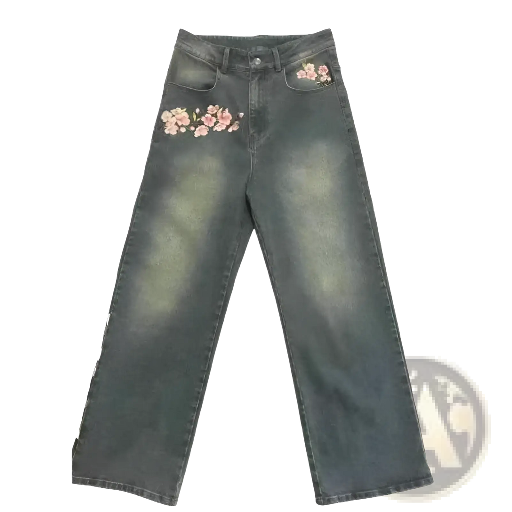 Dark-wash denim jeans with delicate pink floral embroidery on front pockets and thigh area cherry blossom style