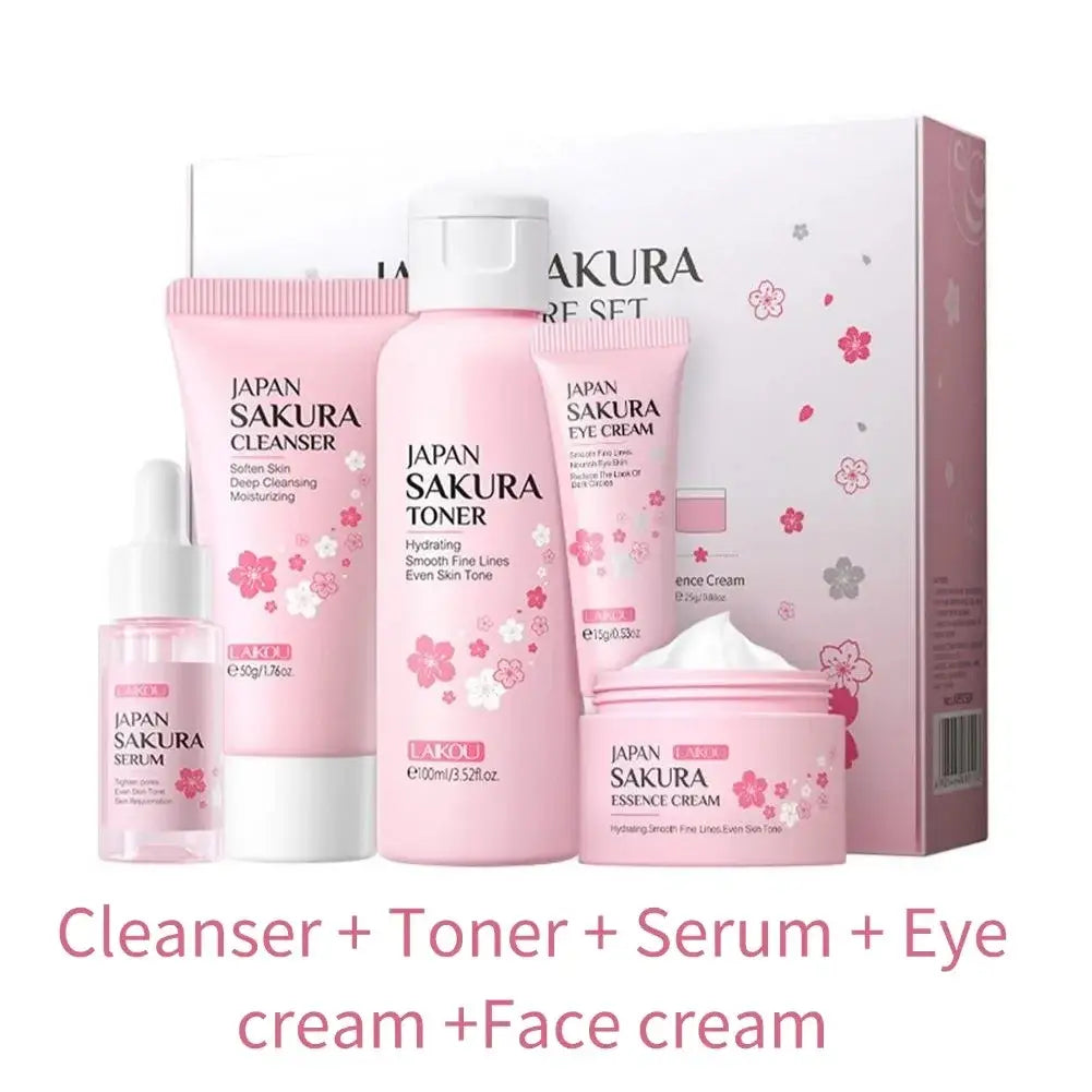 Pink japan sakura cherry blossom travel size skincare set with five pink bottles featuring cherry blossom essence