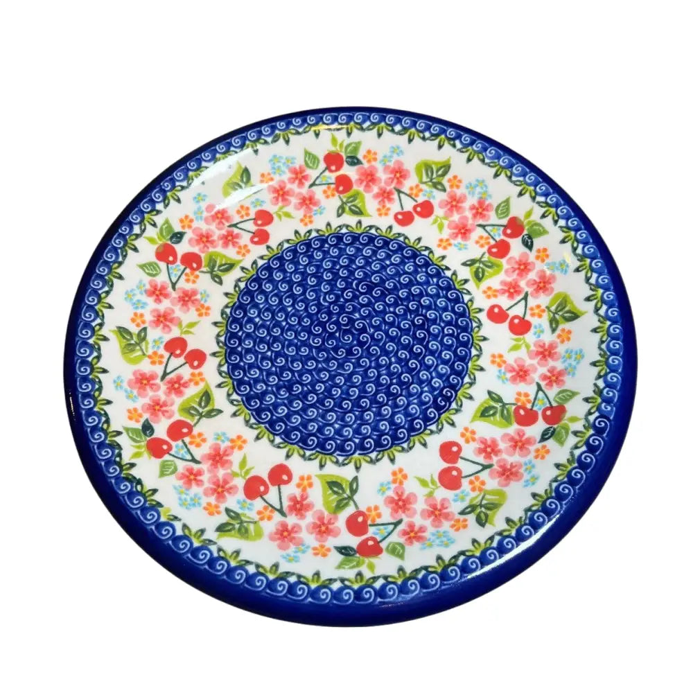 Hand-painted cherry and floral 10 inch ceramic dinner plate with blue swirl center red cherries and pink flowers on white