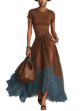 Brown leather handbag with structured shape and decorative metal clasp paired with chic women maxi pieces sets solid brown dress