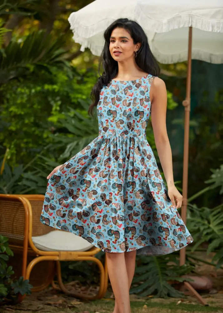 Vintage 1950s light blue cotton sleeveless dress with brown and red rooster print and soft flowing fabric