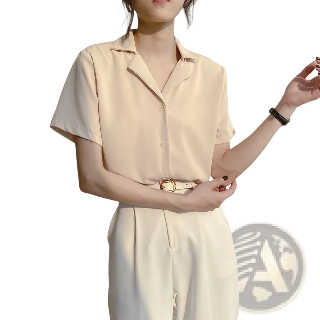 Cream-colored chiffon blouse with short sleeves v neck and subtle sheen ideal for summer wear