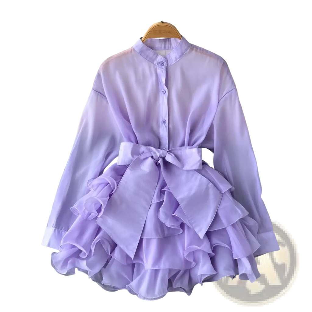 A lavender chiffon ruffle blouse long sleeve top with tiered skirt and matching bow at the waist