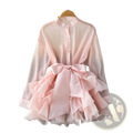A delicate pink chiffon ruffle blouse with long sleeves high collar button-down front and voluminous skirt tie waist