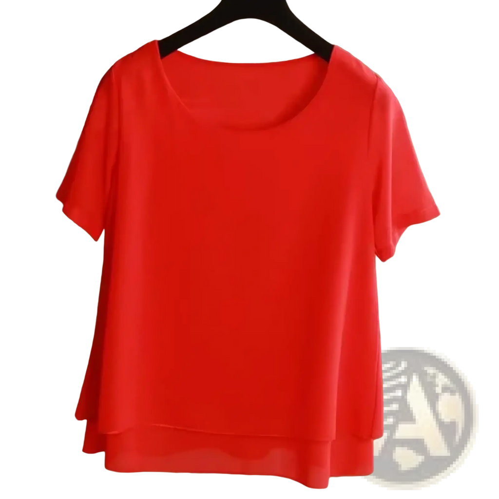 A vibrant red chiffon tiered short sleeve blouse with a layered hemline hanging on a black hanger