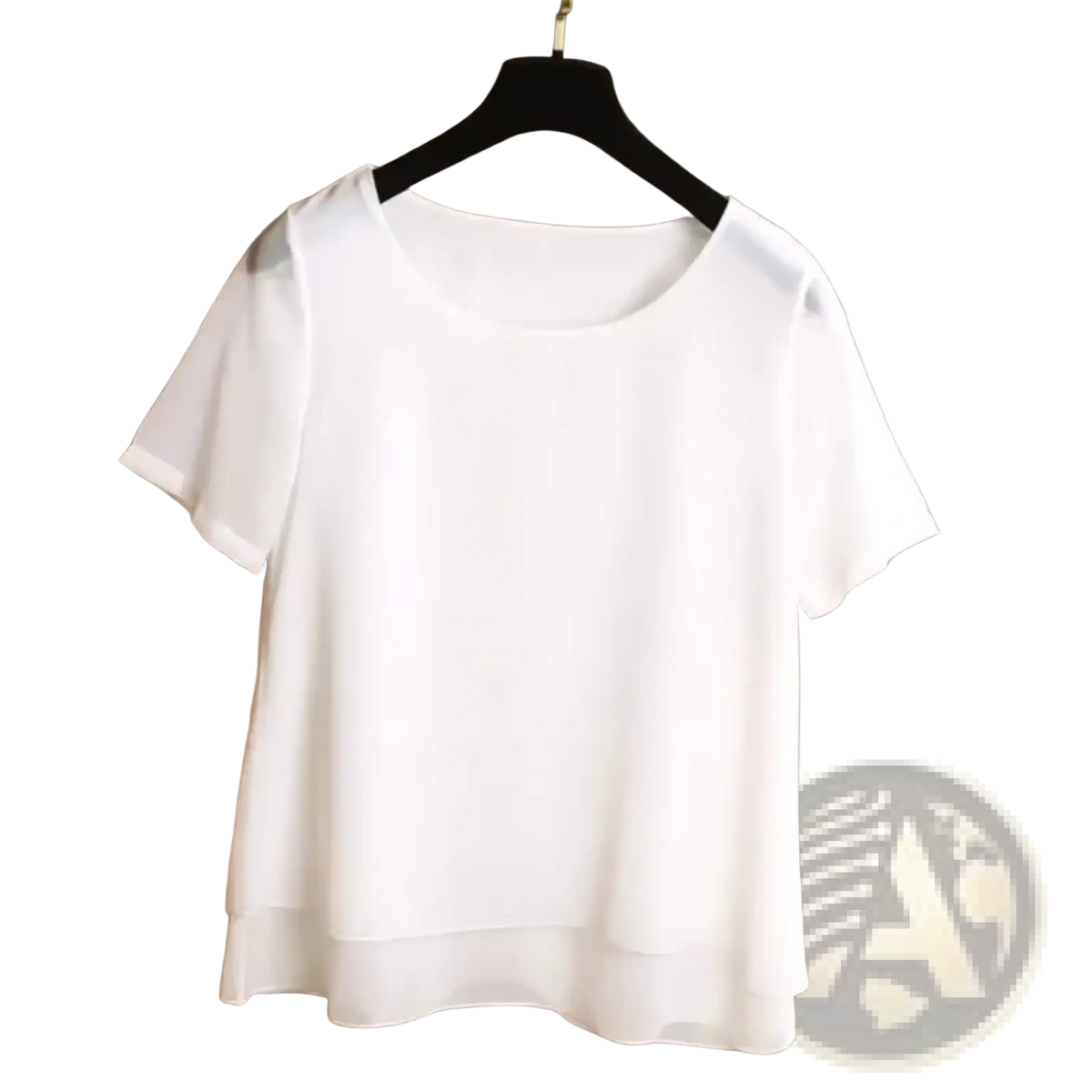 A white chiffon tiered short sleeve blouse featuring lightweight fabric and a flowing hemline