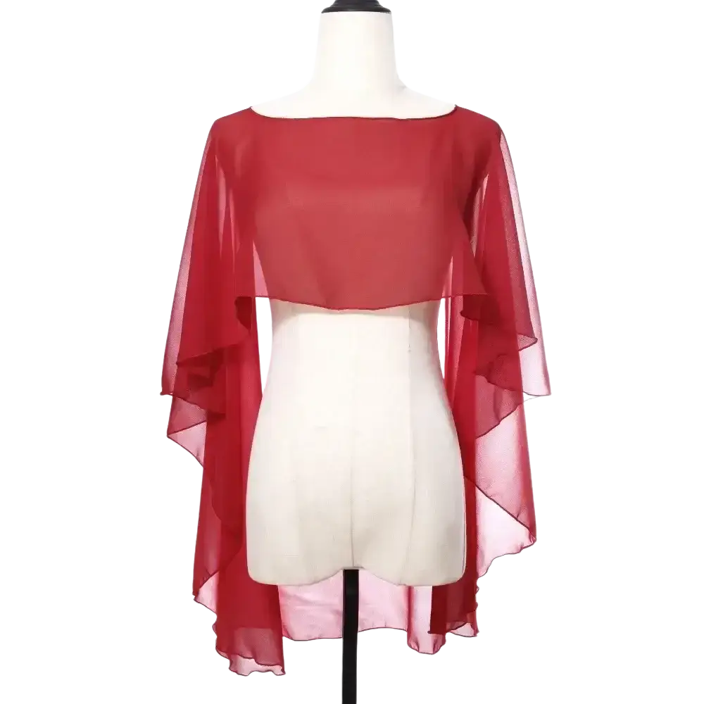 Sheer red chiffon wedding cape with boat neckline and asymmetrical hemline as a sunscreen wrap for weddings