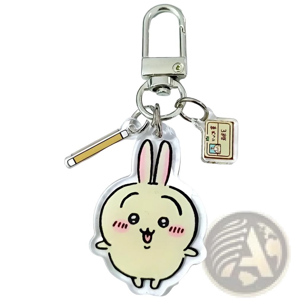 A clear acrylic chiikawa bunny keychain featuring a cream cartoon rabbit with pink ears and blush marks for backpacks