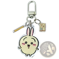 A clear acrylic chiikawa bunny keychain featuring a cream cartoon rabbit with pink ears and blush marks for backpacks