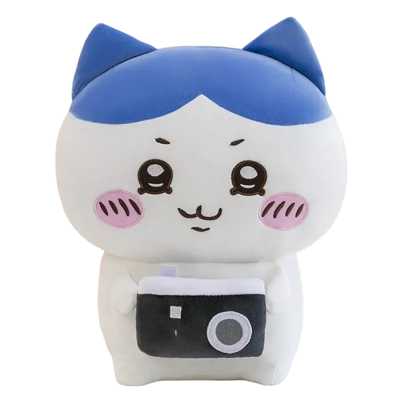 A chiikawa usagi plush toy soft stuffed animal with a white body, blue ears, pink cheeks, and a small camera
