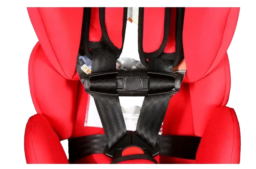 Red child safety seat strap clip with black harness straps and buckle securely attached to a car seat