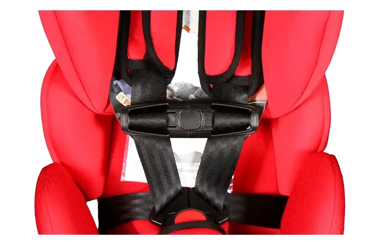 Red child safety seat strap clip with black harness straps and buckle securely attached to a car seat