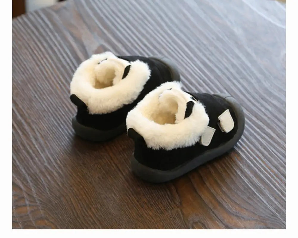 Black panda-themed toddler snow boots with plush white fur lining and soft suede-like exterior for winter wear