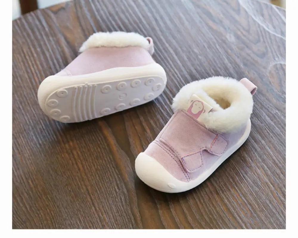 Pink toddler animal themed plush faux fur snow boots with white lining and soft rubber soles for winter wear