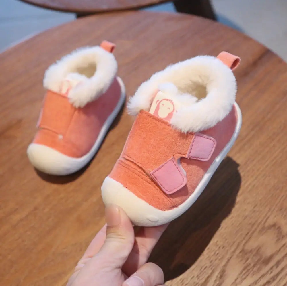 Coral animal themed plush faux fur toddler snow booties with white lining and pink velcro straps for warmth and comfort