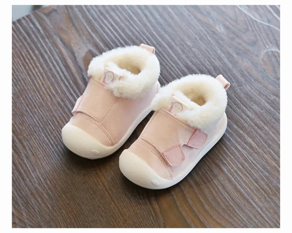 Pink toddler snow boots with soft white faux fur lining and velcro straps from animal themed plush collection