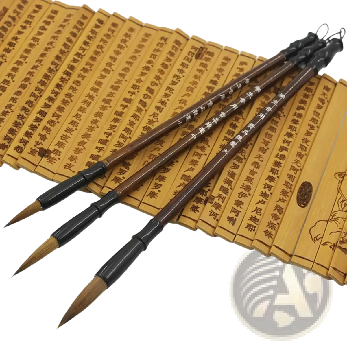 Three traditional chinese calligraphy brushes with dark brown handles and natural bristles for writing practice