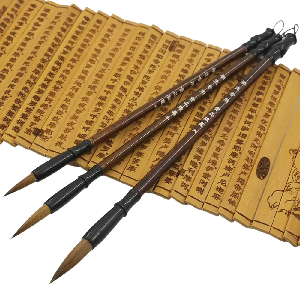 Three traditional chinese calligraphy brushes with dark brown handles and natural bristles for writing practice