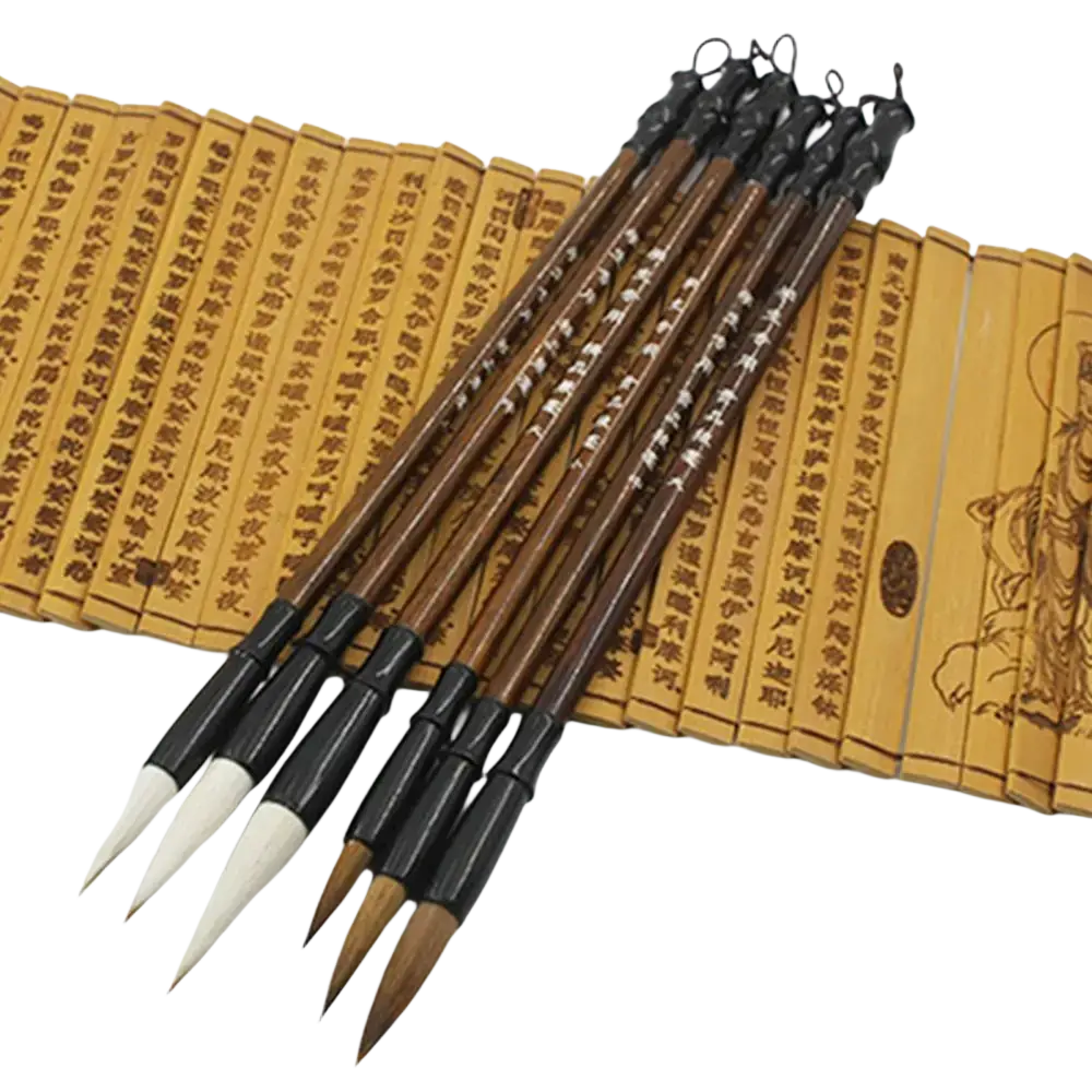 Set of six traditional Chinese calligraphy brushes with black handles and white bristles on bamboo scroll for writing practice