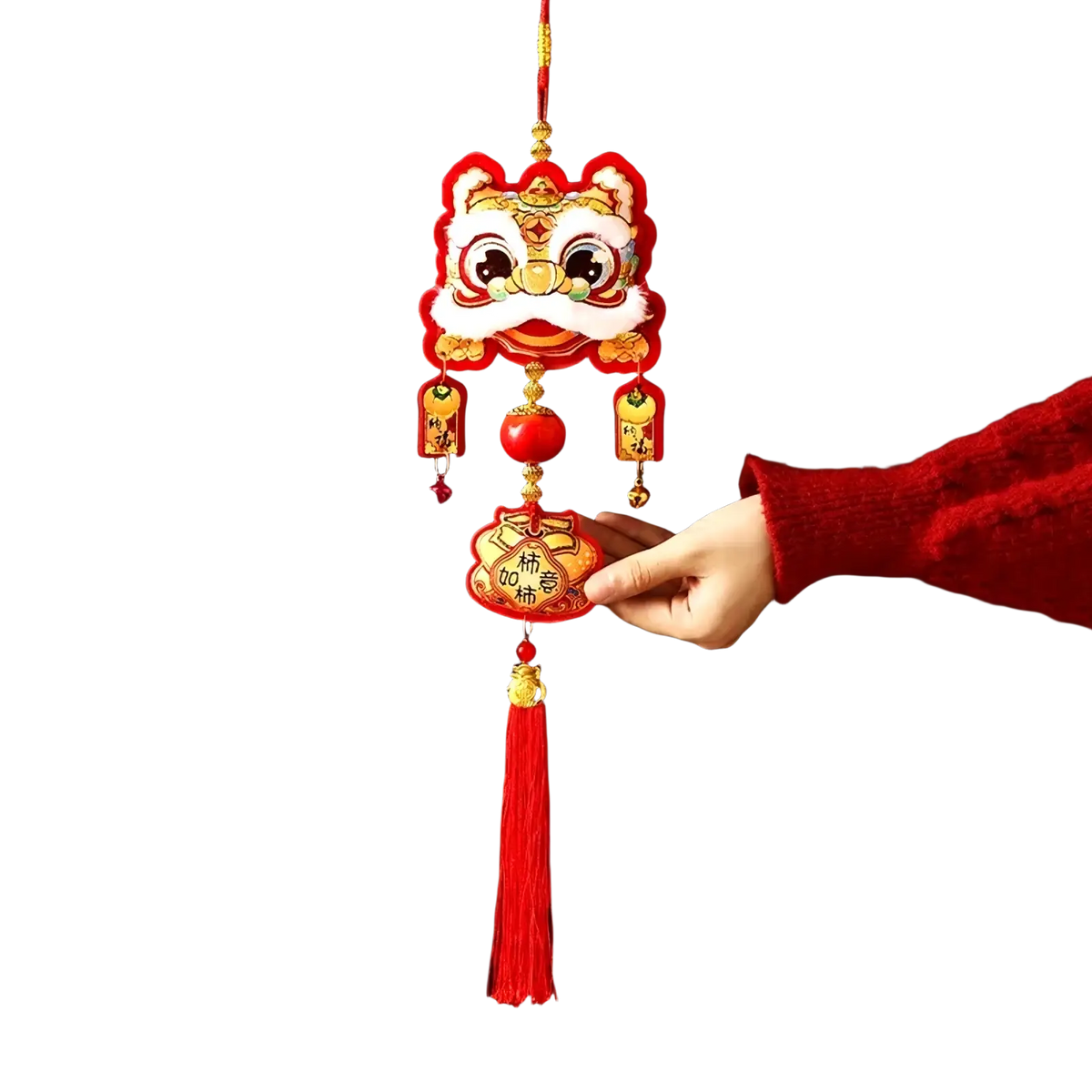 A vibrant red and gold embroidered Chinese lion head hanging ornament with tassel for festive Chinese New Year decor