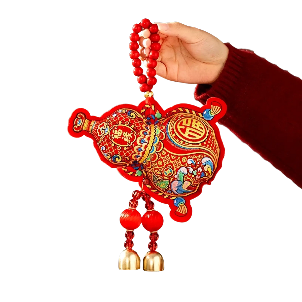 A vibrant red pig-shaped embroidered hanging ornament with gold and blue patterns and festive bells for Chinese New Year decor