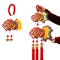 Vibrant red and gold gilded fish ornaments with yellow fins hanging from wooden bead ropes with plush tassels for chinese new year horse decor