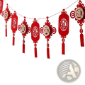 Red paper lantern garland with intricate cut-out chinese characters and tassels for chinese new year decor