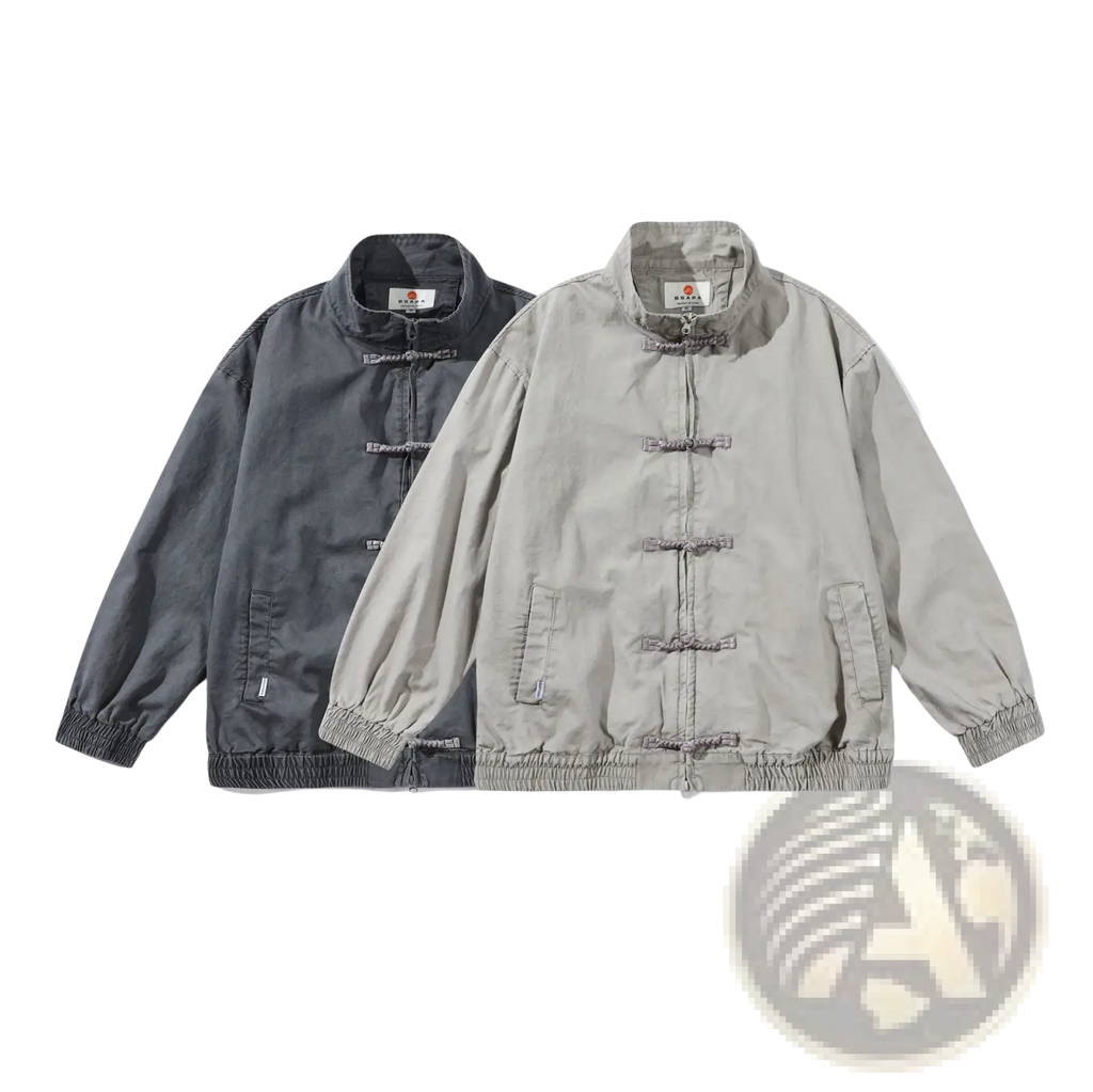 Two minimalist men’s retro jackets in muted gray and beige with chinese-style toggle closures and elasticated cuffs