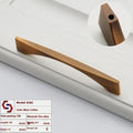 Matte coffee-finished zinc alloy drawer pull with sleek modern design and tapered ends from minimalist brushed brass set