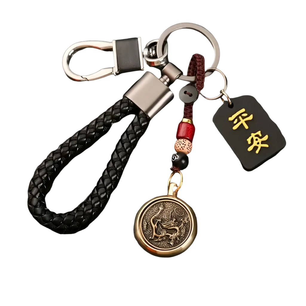 Black braided leather keychain with bronze dragon coin pendant red and black beads and gold chinese character tag