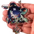 Clear acrylic chiori keychain featuring a chibi character with deep blue hair teal accents and sparkling star details