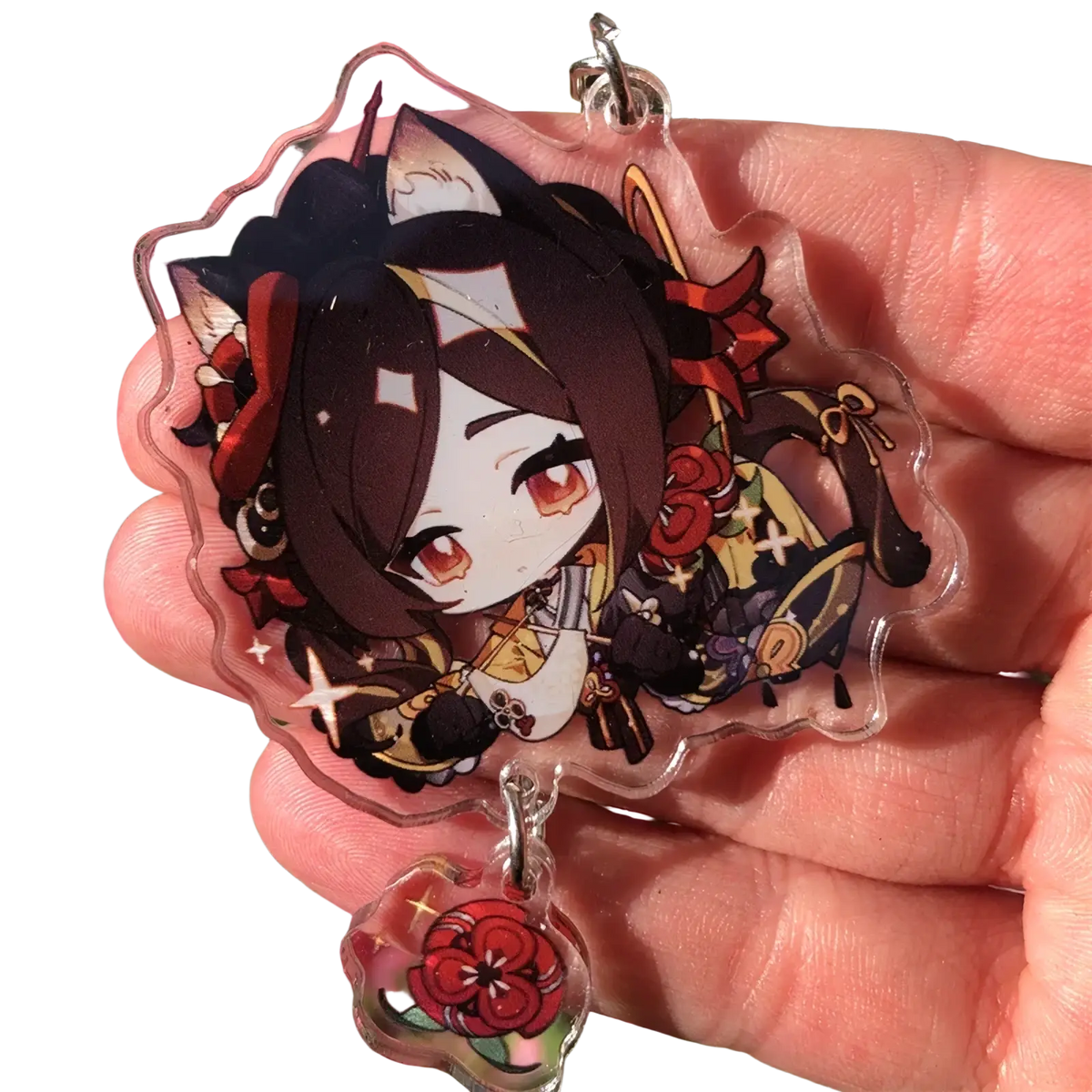 Clear acrylic chiori keychain featuring chibi character with dark brown hair red eyes and ornate gold black red attire