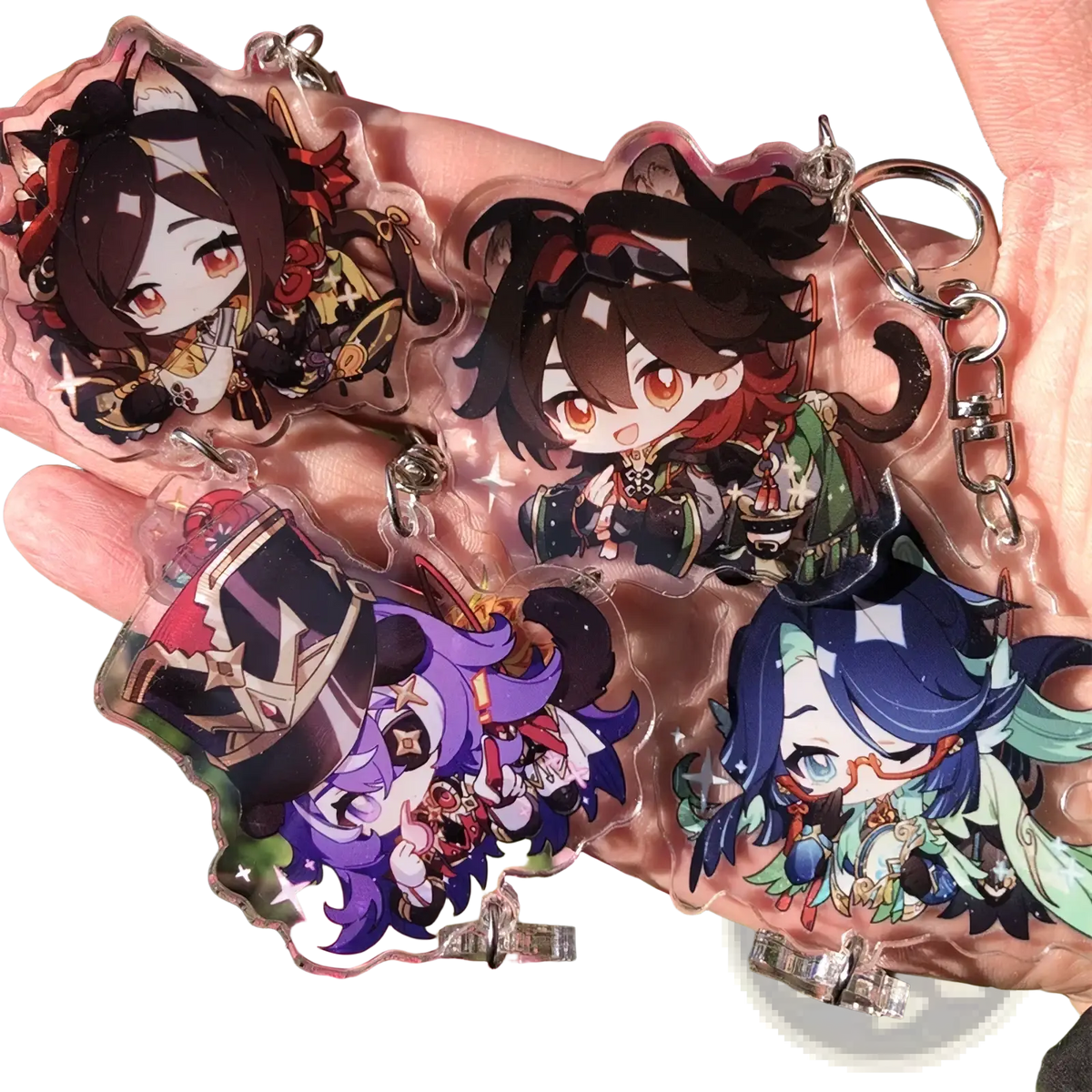Clear acrylic chiori keychains featuring chibi anime characters with vibrant hair and silver metal rings for gaming collection