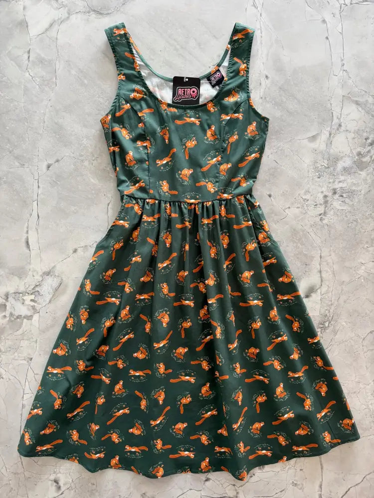 Sleeveless dark green cotton chipmunks vintage fit and flare dress with playful orange squirrel print and pockets