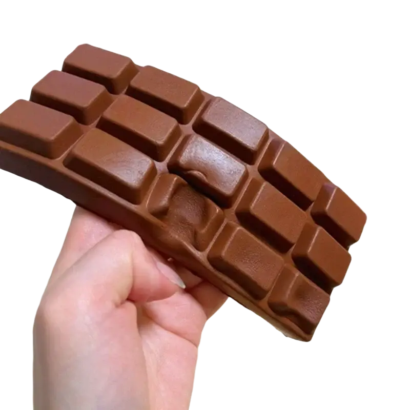 A flexible chocolate-brown silicone chocolate squeeze toy with segmented design for stress relief