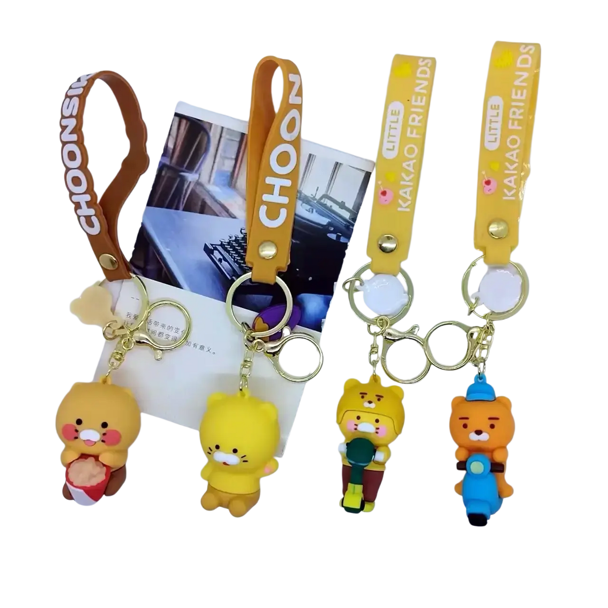 Yellow and orange choonsik silicone scooter keychains featuring plush cartoon animals holding objects or riding scooters