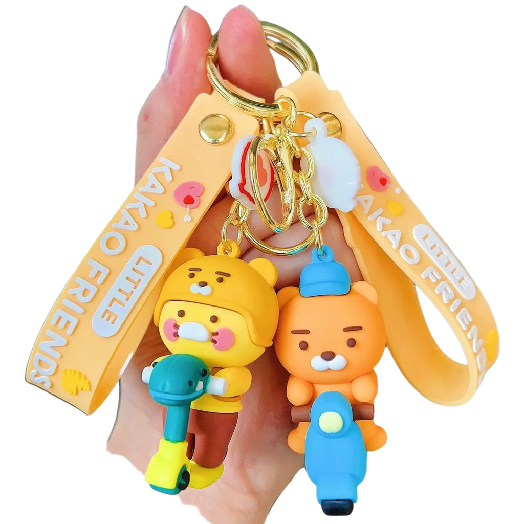 Yellow and orange silicone choonsik scooter keychain with kakao friends characters and gold metal ring wrist strap