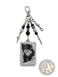 Clear acrylic choso y2k anime keychain with black and white spiky hair character and silver metal bead spike dagger charms
