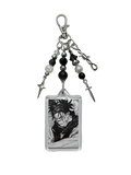 Clear acrylic choso y2k anime keychain with black and white spiky hair character and silver metal bead spike dagger charms