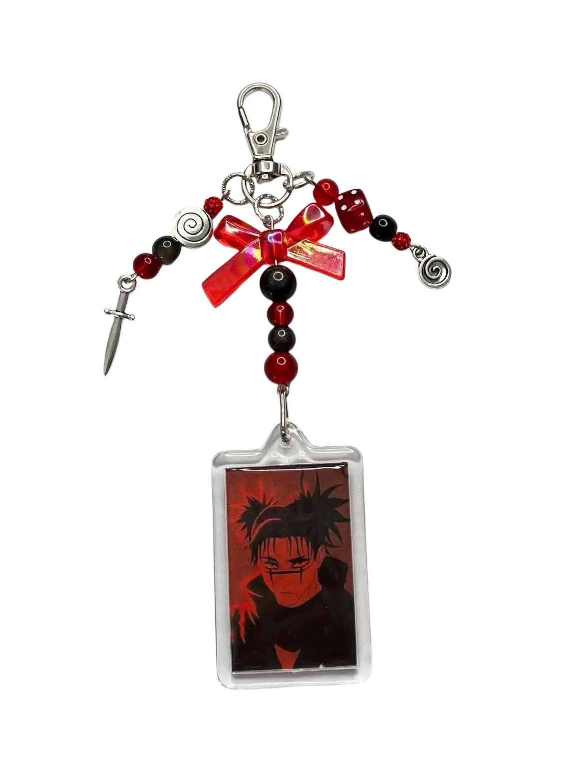 A red and black acrylic keychain featuring choso portrait with beads dice bow and metallic charms in y2k anime style