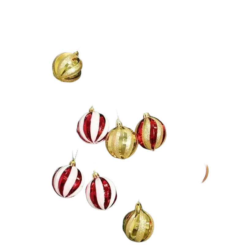 Shiny red and gold striped christmas ball ornaments hanging on a frosted artificial christmas tree branches